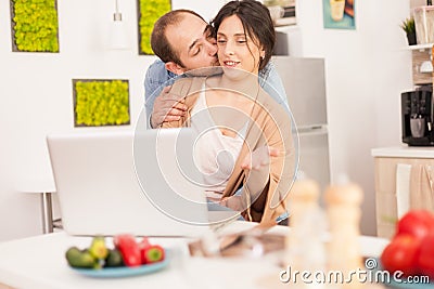 Husband kissing wife cheek Stock Photo