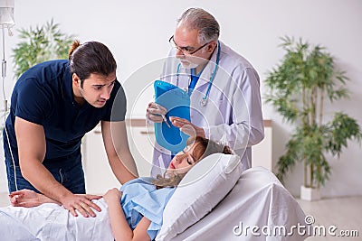 Young husband visiting sick wife in the clinic Stock Photo