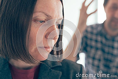 Husband and wife arguing, man yelling at woman Stock Photo