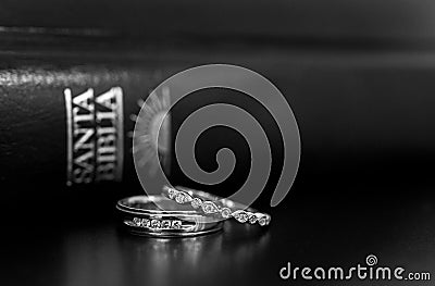 Wedding rings and Spanish Bible Stock Photo