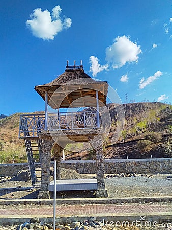 Hut on beach with top roof is Timor-Leste traditional sacred house in one dollar beach, Metinaro. Stock Photo