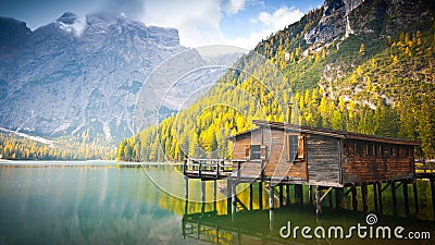 Hut on Braies lake in autumn Stock Photo