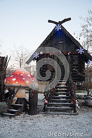A hut made of dark wood. The hut of a character in Russian fairy tales. Baba Yaga`s House. The hut stands on chicken legs Stock Photo