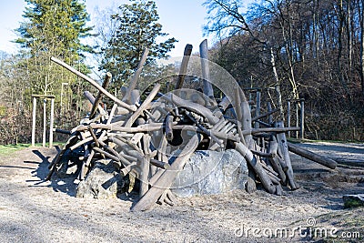 Hut made of tree trunks on stone age playground of Neanderthal Museum, Mettmann, Germany. Stock Photo