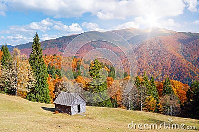 Hut in a mountain forest. Autumn Landscape Stock Photo