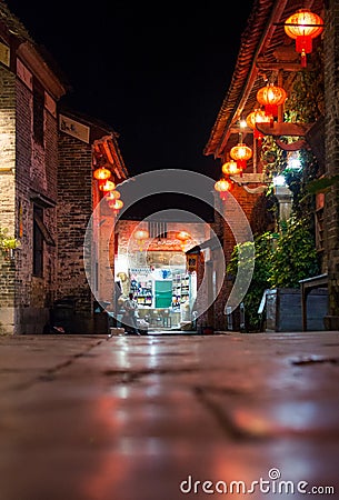 HUZHOU, CHINA - MAY 2, 2017: Huang Yao Ancient Town street in Zhaoping county, Guangxi province. Night view of traditional Chines Editorial Stock Photo