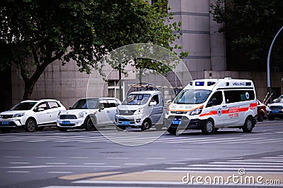 Huzhou, China 2020 September 28: Ambulance Car rush hours city street. Cars on road in traffic jam on pedestrian Editorial Stock Photo