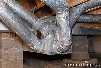 HVAC ductwork, air duct, in crawlspace of house. Stock Photo