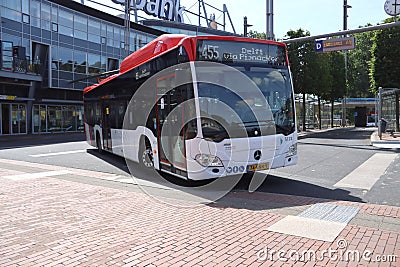 Hybrid EBS bus on line 455 to Delft leaves from Editorial Stock Photo