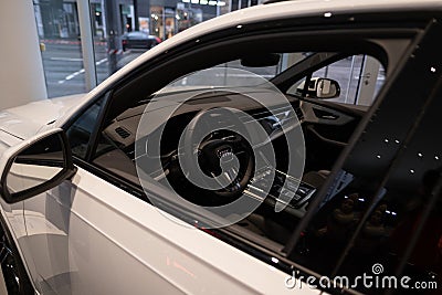 hybrid SUV Car Audi e-tron Q7 quattro, white multi-drive vehicle in showroom, Sustainable Mobility, Advanced Automotive Technology Editorial Stock Photo