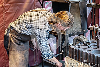 Hyde Park, London, UK 5th January, 2020. Male blacksmith working in workshop Editorial Stock Photo