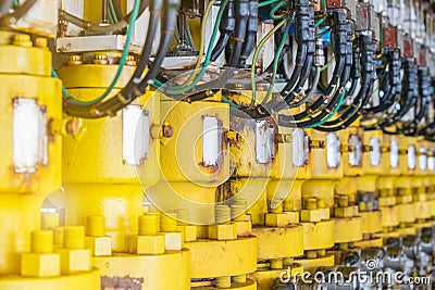Hydraulic choke or throttle valve at oil and gas wellhead remote platform. Stock Photo