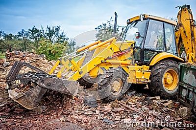 Hydraulic crusher, industrial excavator machinery working on site Stock Photo