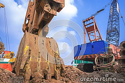 Hydraulic Diaphragm wall equipment of boring machine with Earth Drilling crawler Crane is working in road construction site Stock Photo