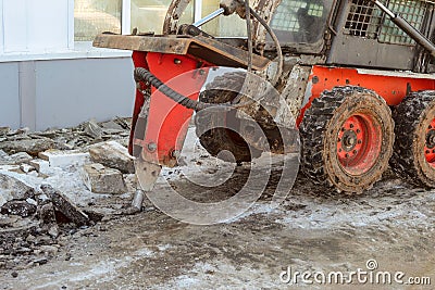 Hydraulic jack hammer destroy crushes frozen asphalt Stock Photo