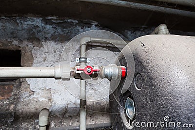 Hydraulic pipes an valves in basement Stock Photo