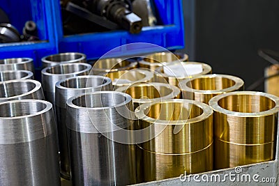 Hydraulic piston and cylinder on a rack in a warehouse Stock Photo