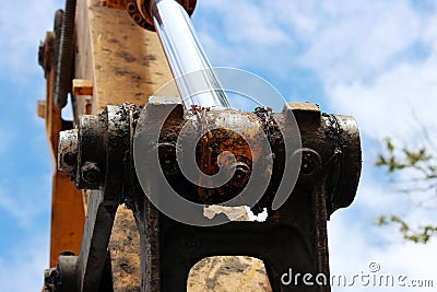 Hydraulic piston system for bulldozers, tractors, excavators, chrome plated cylinder shaft of yellow machine Stock Photo