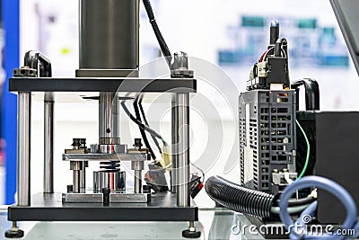 Hydraulic press machine and computer or controller during metal spring test property durability endurance fatigue pressure force Stock Photo