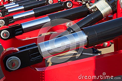 Hydraulic shock absorber. Cultivator for cultivating the land Stock Photo