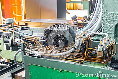 Hydraulic system of the machine, oil under pressure in hydraulic pipes, repair of industrial equipment control systems Stock Photo