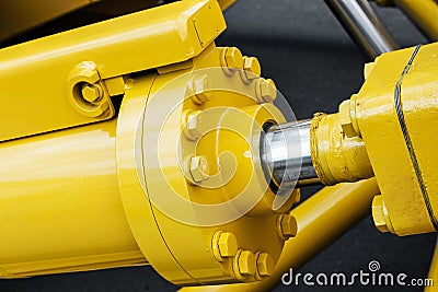 Hydraulics tractor yellow Stock Photo