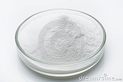 Hydro-gel in the glass, fine powder on the white surface Stock Photo