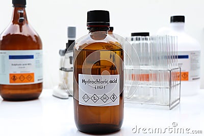 hydrochloric acid in bottle , chemical in the laboratory and industry Stock Photo