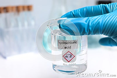 Hydrochloric acid in glass, chemical in the laboratory Stock Photo