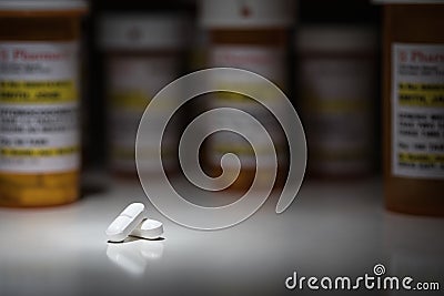Hydrocodone Pills and Prescription Bottle with Non Proprietary Label Stock Photo