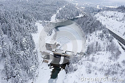 Hydroelectric power station with weir system on the Lech river on the motorway in winter Stock Photo