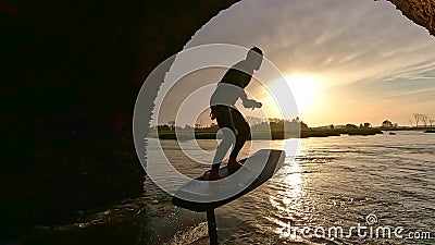 Hydrofoil rider gliding over the water Stock Photo