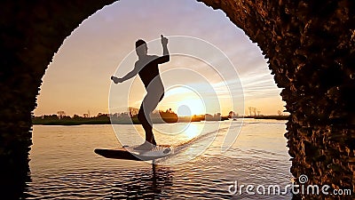 Hydrofoil rider gliding over the water Stock Photo