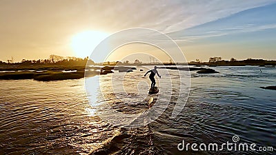 Hydrofoil rider gliding over the water Stock Photo