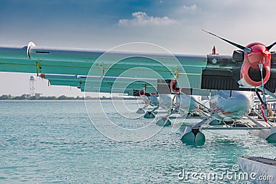 Seaplane or hydroplane near the wooden pier at the Male airport, Maldive Stock Photo