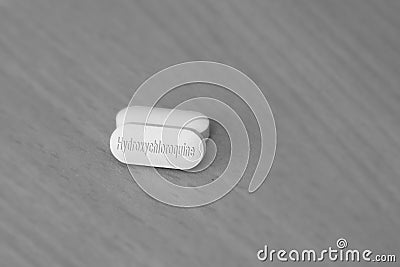 Hydroxychloroquine tablet medication for treatment Malaria, and potential new drug cure for COVID 19 Corona virus closeup. Therapy Stock Photo