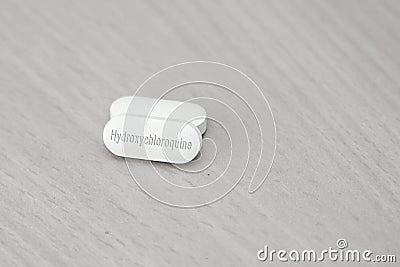 Hydroxychloroquine tablet medication for treatment Malaria, and potential new drug cure for COVID 19 Corona virus closeup. Therapy Stock Photo