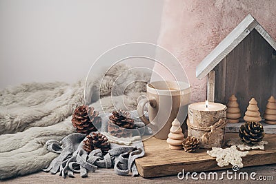 Hygge Scandinavian style concept with coffee cup, candles and pi Stock Photo