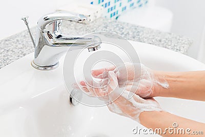 Hygiene. Cleaning Hands. Washing hands on sink. Stock Photo