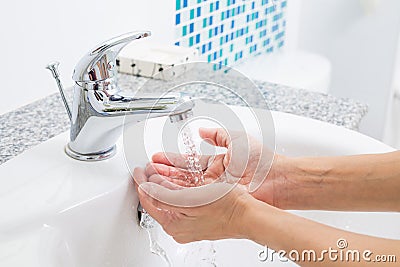 Hygiene. Cleaning Hands with water. Washing hands on sink. Stock Photo