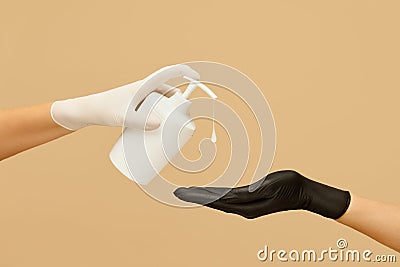 Hygiene. Hands In Gloves Using Liquid Soap To Stop Spreading Of COVID-19. Daily Routine With Antibacterial Products Stock Photo
