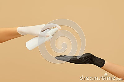 Hygiene. Hands In Gloves Using Spray Antiseptic To Stop Coronavirus Spreading. Daily Routine With Antibacterial Products Stock Photo