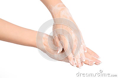 Hygiene and health protection topic: a woman's hand in soapsuds isolated on white background in studio Stock Photo
