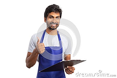 Hypermarket manager with thumb up holding clipboard Stock Photo