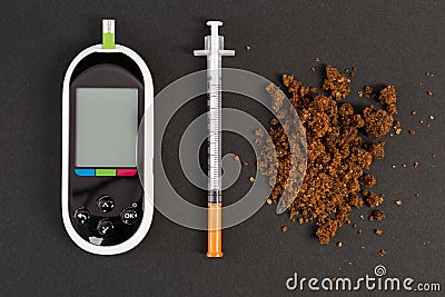 Hypoglycemia concept with glaucometer insulin syringe and brown Stock Photo