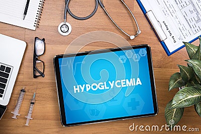 Hypoglycemia Professional doctor use computer and medical equipment all around Stock Photo