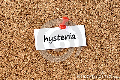 Hysteria. Word written on a piece of paper, cork board background Stock Photo