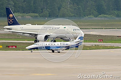 HZ-ASB Saudi Arabian Airlines Airbus A320-214 jet and a Air Adriatic Cessna Citation 560 XLS+ in Zurich in Switzerland Editorial Stock Photo