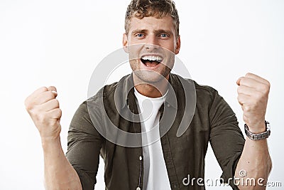 I believe in you. Portrait of supportive cheering handsome man with blue eyes and white broad smile trying encourage Stock Photo