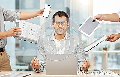 I can do it, I just need to stay focused. a young businessman looking calm in a demanding office environment. Stock Photo